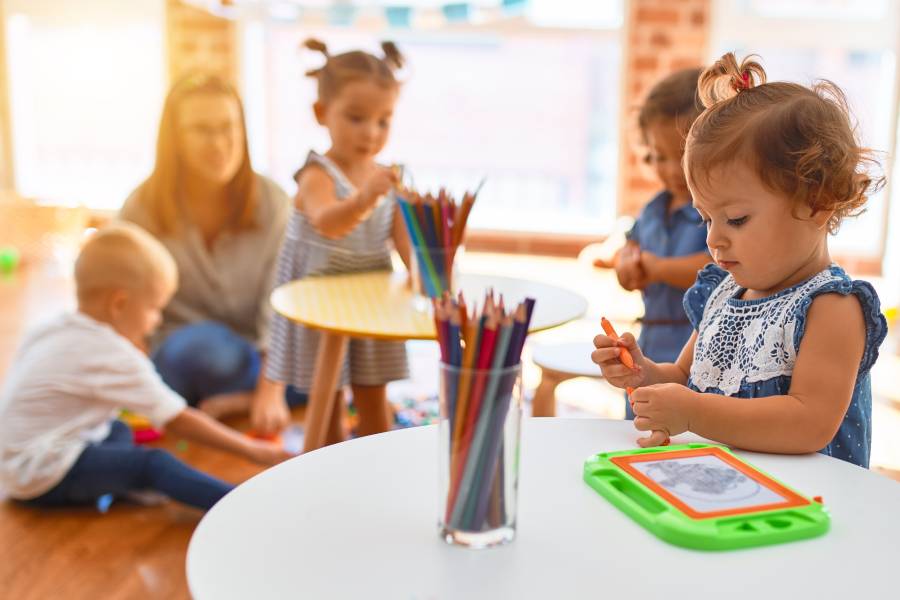 toddlers engaged in indoor activities on a rainy day