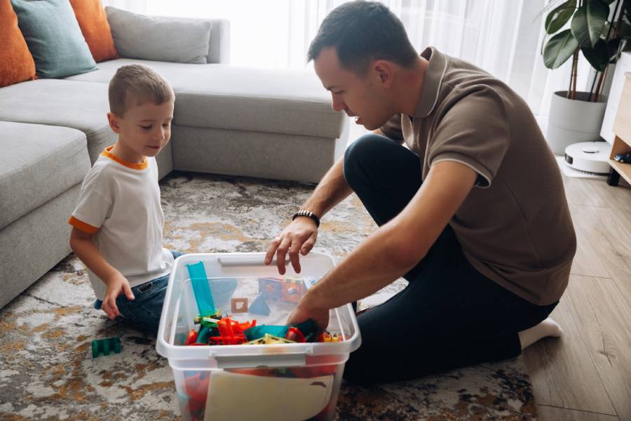 Father and son sorting toys